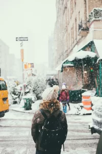 Woman walking down the street in winter