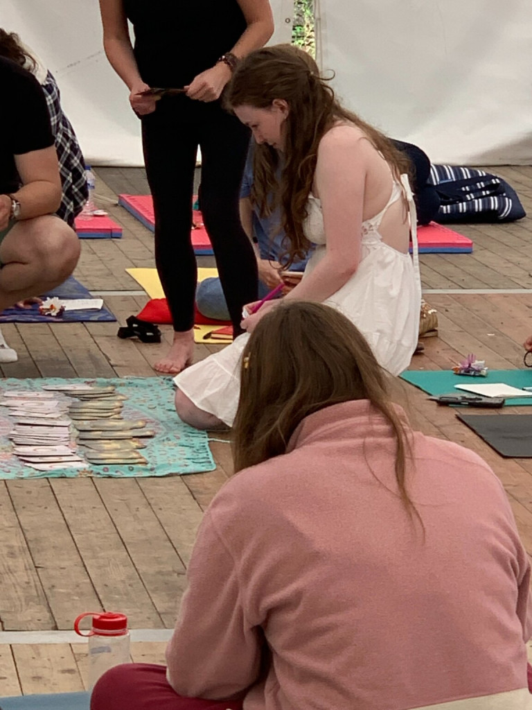 A young girl partaking our journaling and vision boarding class